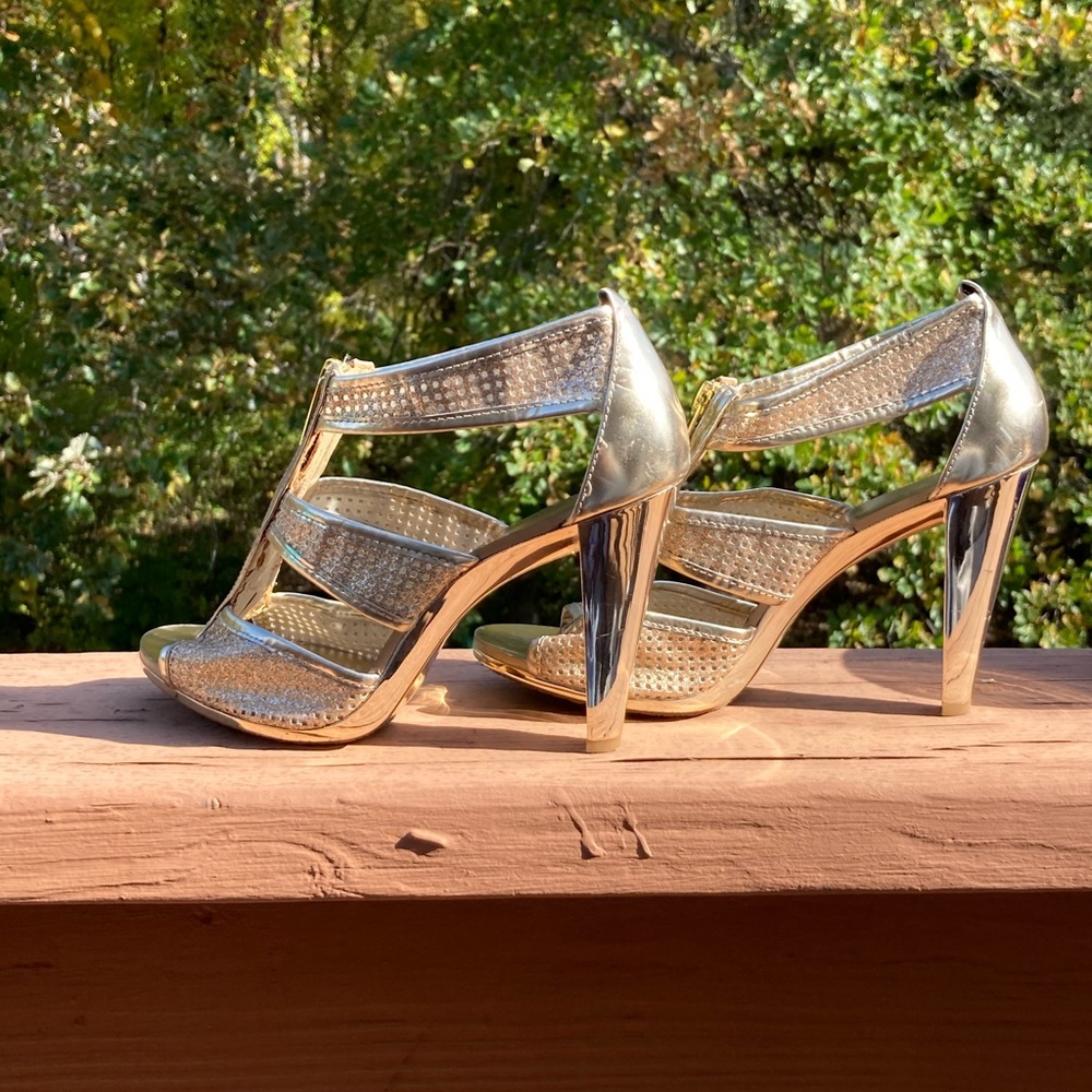Michael Kors Gold Heel. A few scratches as shown in pic but not that noticeable.